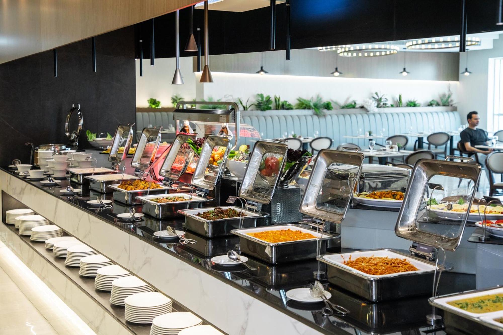 エリート ビブロス ホテル ドバイ エクステリア 写真 A buffet at a restaurant