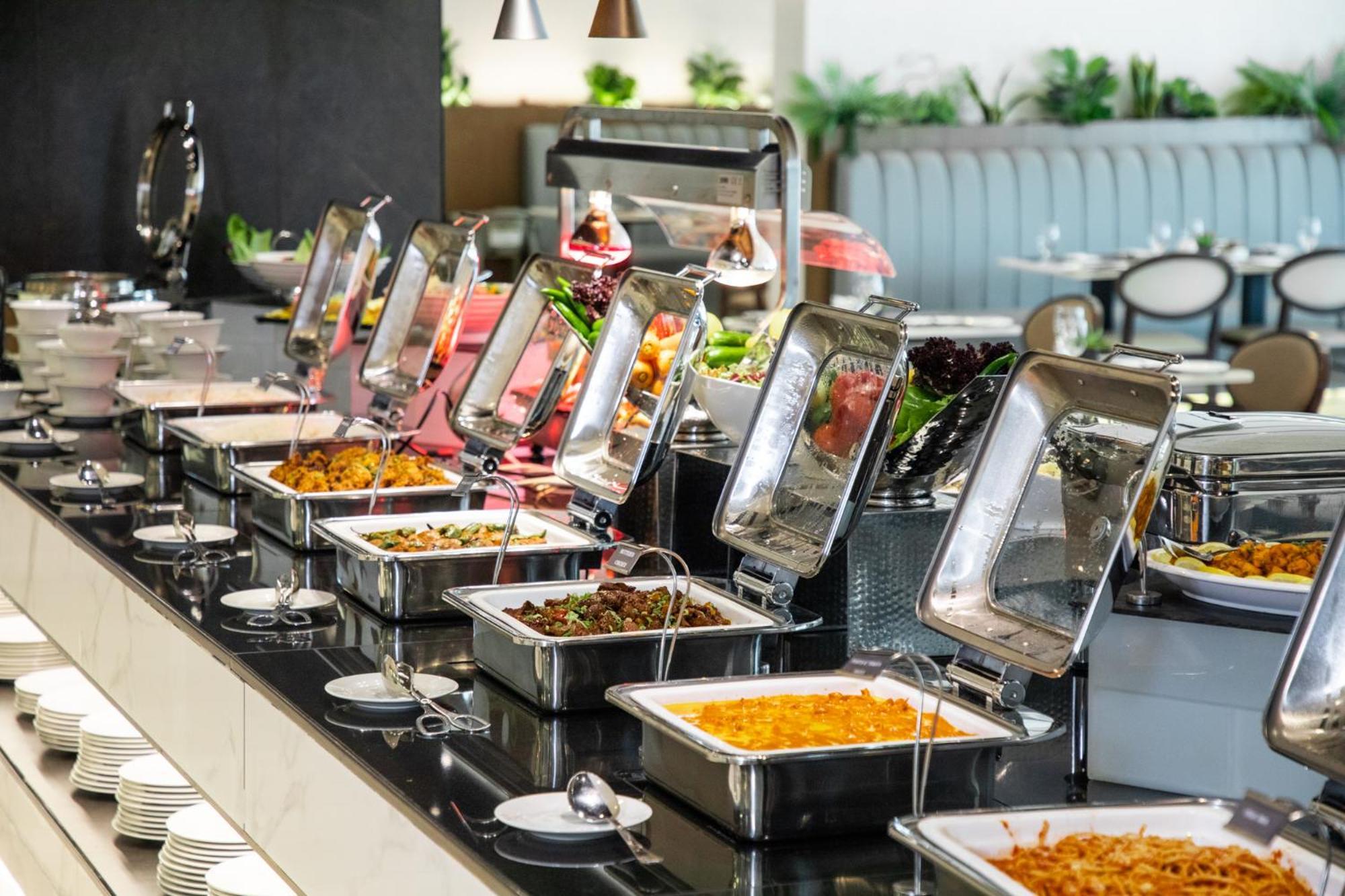エリート ビブロス ホテル ドバイ エクステリア 写真 A buffet at a hotel